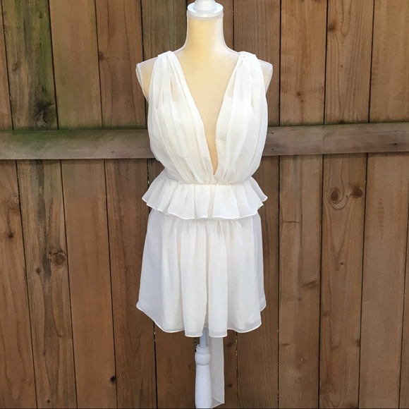 Luxxel Dresses & Skirts - Luxxel Creme Peplum Dress w/Crisscross Back NWT